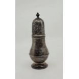 A silver baluster form caster, London 1930, makers mark rubbed, with pierced and engraved cover,