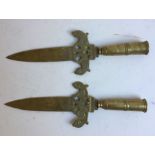 A pair of Indian bronze knives. (2)