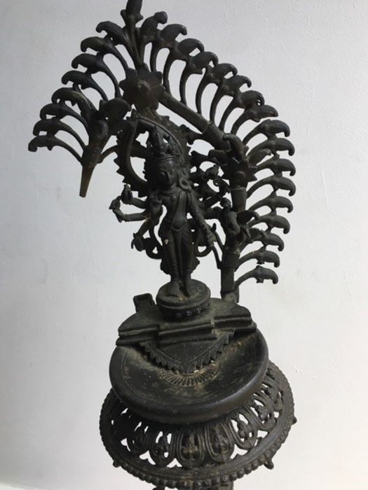 A large Indian bronze lamp. H:85cm approx. (a/f) - Image 2 of 3