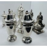A collection of eight sterling silver pepperettes/casters. Featuring a Viners salt and pepper shaker