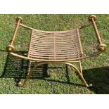 A gilt metal stool