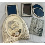 A collection of sterling silver photograph frames and white metal items. Featuring an Indo-Burmese