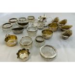 A collection of silver salts. Comprising four embossed basket form salts, two fluted bowls, a fluted