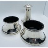 A matched set or two sterling silver salts and pepperette marked for Joseph Gloster Limited.   The