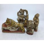 A collection of four Indian carved soapstone figures. H:14cm (tallest) (4)