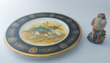 A Coalport artist's sample plate painted with a bee-eater by R. Blyth within a black and gilt