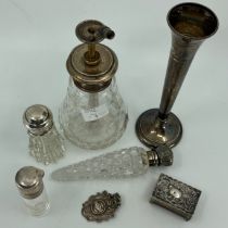 A Victorian cut glass tapering scent bottle with silver cover, another cylindrical example with