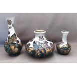 A trio of Moorcroft Blackberry Bramble pattern C1994 ,possibly Sally Tuffin vases, decorated with