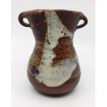 A Janet Leach (1918-1997) for Leach Pottery. Stoneware vase with twin handles. Impressed JL and