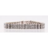 A diamond panel bracelet set with an estimated 19.45 carats of diamonds, in white metal stamped 18K.