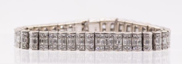 A diamond panel bracelet set with an estimated 19.45 carats of diamonds, in white metal stamped 18K.