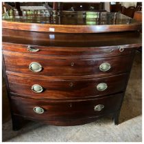 A George III mahogany bow front chest with brushing slide above four long graduated drawers, stamped