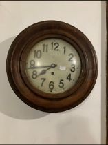 10. A continental wall clock with single train. Spring driven movement. 9.5" dial. Contained in a