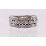 A fine Hancocks 14 brilliant cut Diamond dress ring ,with outer rows of 33 baguette cut diamonds