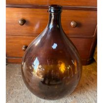 Large brown glass bottle vase
