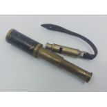 A De Courcy and co WW I trench whistle, dated 1916 and a brass two draw small telescope  (2)