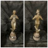An Art Nouveau bronze figure of a lightly draped maiden holding a floral garland, foundry stamp "