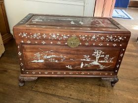 A mother of pearl inlaid oriental wooden chest with brass furniture on bracket ball and claw feet (