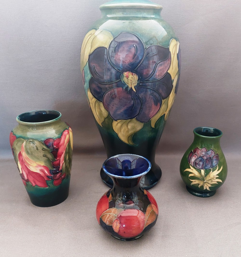 A collection of Moorcroft to include a tall Hibiscus pattern lamp base and 3 smaller vases , various