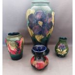 A collection of Moorcroft to include a tall Hibiscus pattern lamp base and 3 smaller vases , various