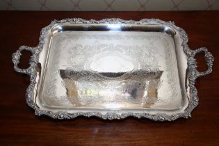A late Victorian EPNS A1 silver plated wine tray, circa 1890, with raised scroll/rocaille border,