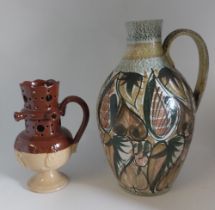 A Bourne Denby Stoneware coloured puzzle jug C1900. Standing 21 cm tall and a large hand decorated