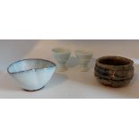 A Mixed lot of studio pottery comprising two glazed egg cups, a glazed bowl and a raku bowl in