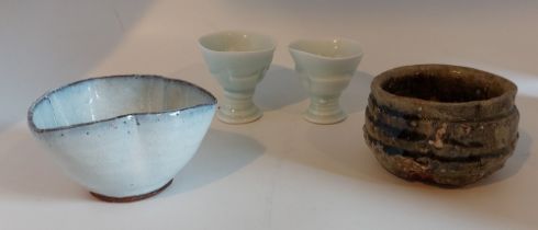 A Mixed lot of studio pottery comprising two glazed egg cups, a glazed bowl and a raku bowl in