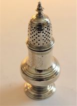 A George II silver baluster shaped pepperette, the pierced cover with turned finial, London 1751