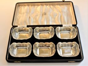 A matched set of six pierced rounded rectangular sweetmeat dishes, Birmingham 1919 and 1920, 220g