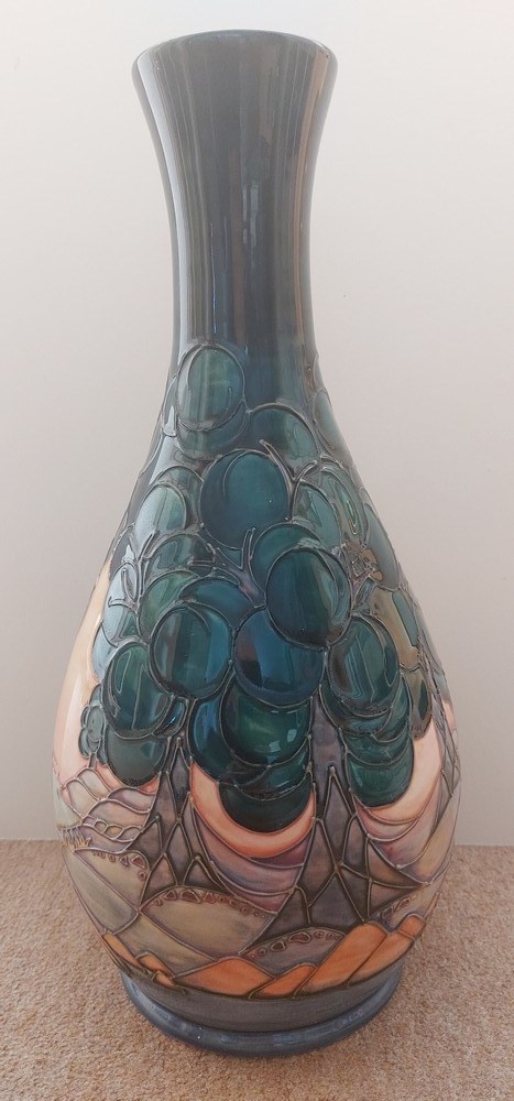 A very tall tube lined stylised Moorcroft vase, decorated with trees and landscape, with a river, - Image 2 of 7