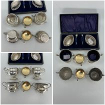A pair of Victorian stamped silver oval small open salts, apparently unmarked and a pair of salt