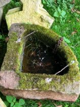 Corner stone trough with remains of metal bars..  Approximate size 30" at widest point, back to