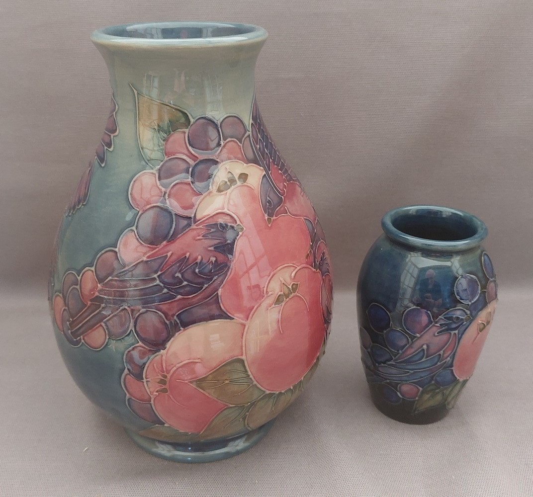 2 early tube lined stylised Moorcroft vases, decorated in the fruit and fiches pattern, with the - Image 2 of 8