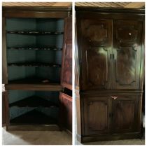 A George III mahogany floor standing corner cupboard, the dentil cornice above a pair of doors