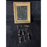 Collection of 18 antique cork screws 9 loose and 9 in a framed rustic and unusual rare corkscrews.