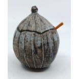 A Yo Thom. Stoneware lidded spice pot with wooden spoon. stands 8 cm tall to the rim of the base
