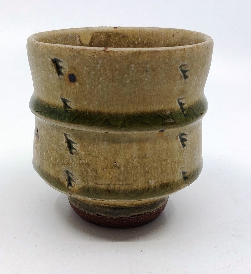 A Phil Rogers (1951-2020). Stoneware yunomi (tea cup). in a green glaze, with Impressed marks.