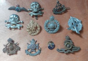 Various cap badges to include Sherwood Foresters, RFC, Reconnaissance corps etc