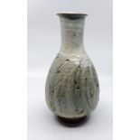 A Phil Rogers (1951-2020) Stoneware vase.  In a pale green and off white  glaze. With an impressed