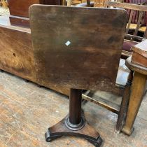 A William IV mahogany tilt top table, square curved corner top, cylinder columns on a triform