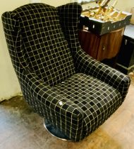 Andrew Martin fabric swivel armchair on a chrome base black  baric with a gold/yellow check.