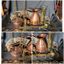 Collection of copper and brass items kettle, measuring jug, horse brasses on leather strap, fireside