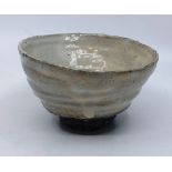 A Lee Kang-Hyo (born 1961). Stoneware footed raku glazed  bowl. Appears unmarked but handwritten