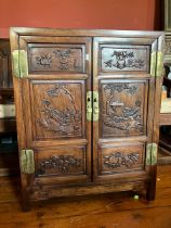 Oriental hard wood  (Chinese) Cupboard containing two central internal suspended drawers extensive