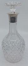 A hobnail cut glass baluster shaped decanter and mushroom stopper, the neck with partly reeded