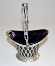 A late 19th/early 20th century German silver oval basket with pierced lattice decoration and loop