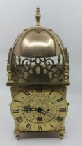 A Eureka electric lantern clock, the 18cm chapter ring stamped no 2217, signed Eureka clock co ltd