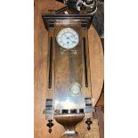 7. Vienna wall clock with 8 day single train spring driven movement with 5" two piece dial. Roman