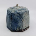 A Stoneware lidded jar. Salt-glaze maker unknown. Crackle glazed in blue, stands 12 cm tall to knop